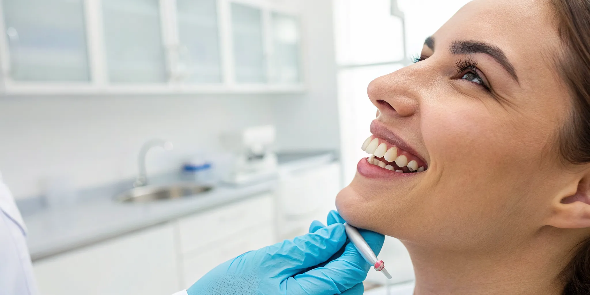 Woman smiling after her cosmetic dental bonding procedure.